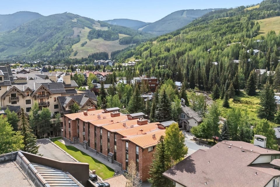 Enjoy the stunning alpine landscape, featuring lush evergreen forests and rolling mountain peaks
