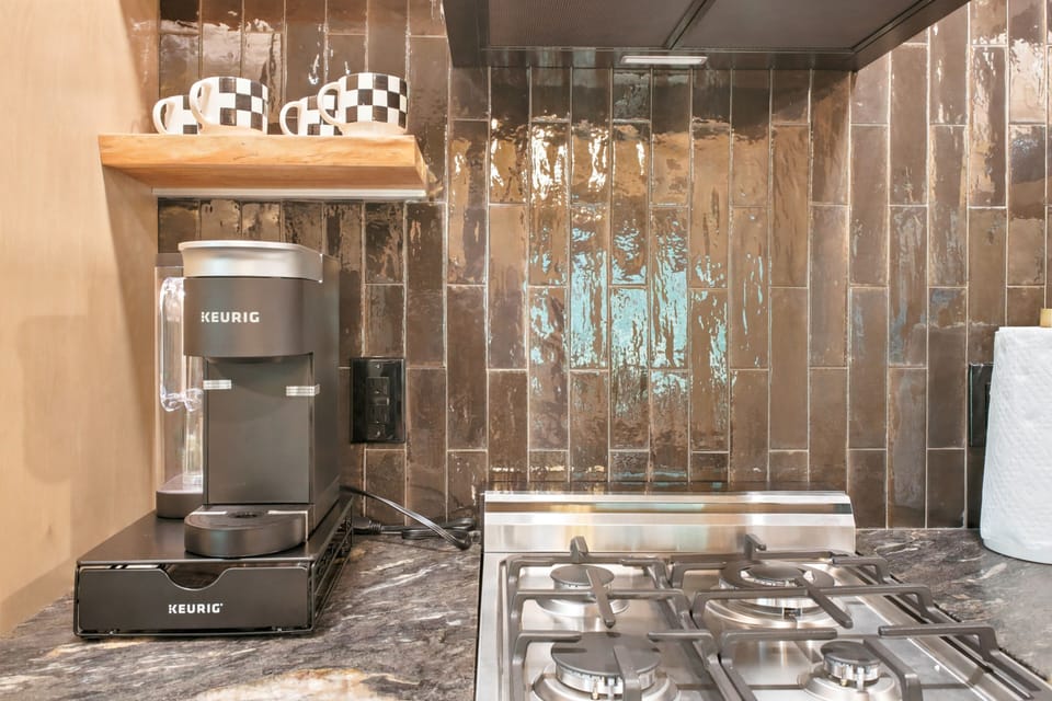 Cook up something delicious in this stylish kitchen, complete with a gas cooktop and a dedicated Keurig station to fuel your mornings before mountain adventures.