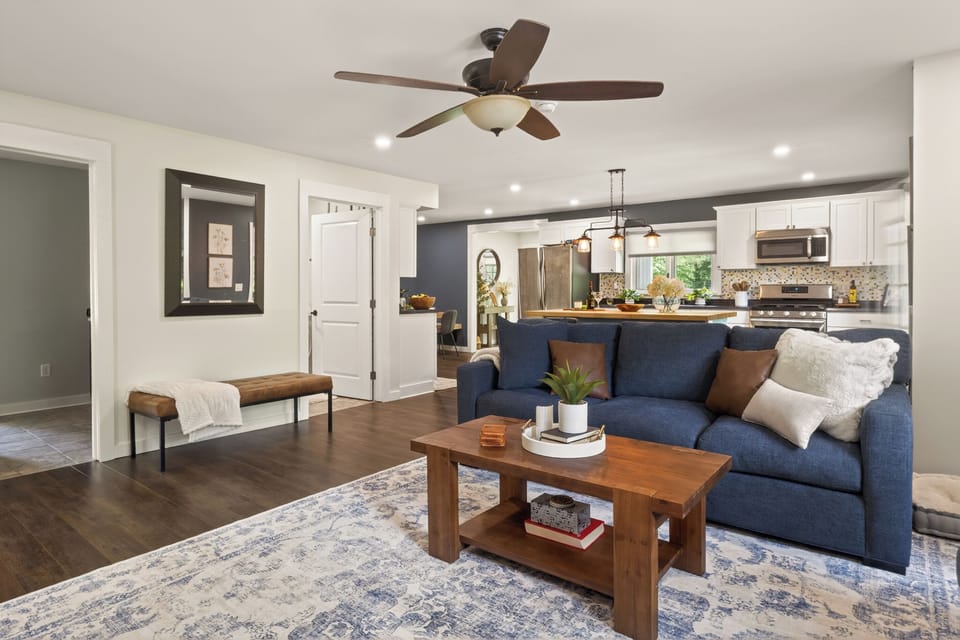 Blue sofa facing the open kitchen