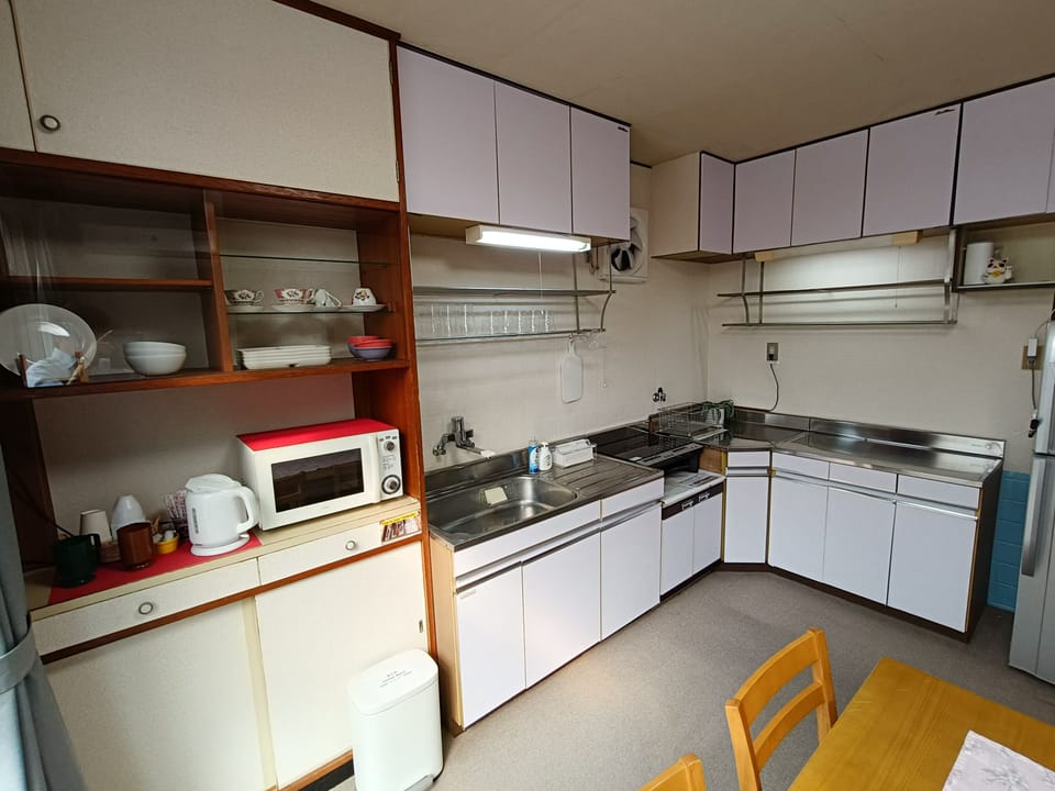 Mini-fridge, microwave, stovetop, cookware/dishes/utensils