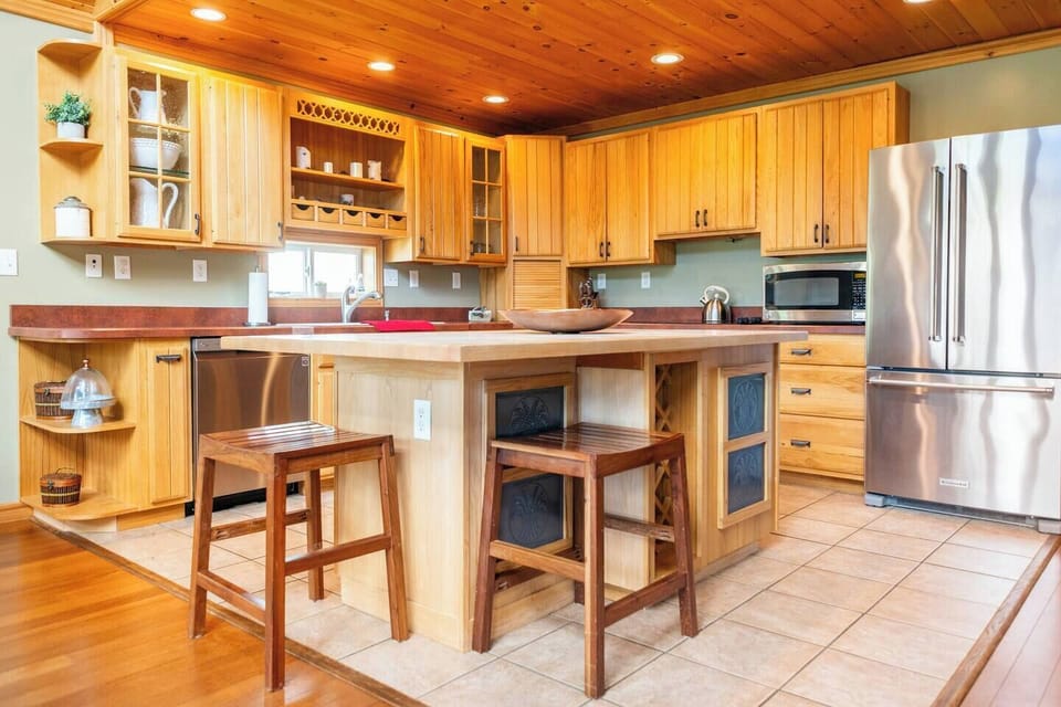 Gather around the center island in our fully equipped kitchen with all updated appliances to prepare a meal or just swap stories and laugh with your family and friends!