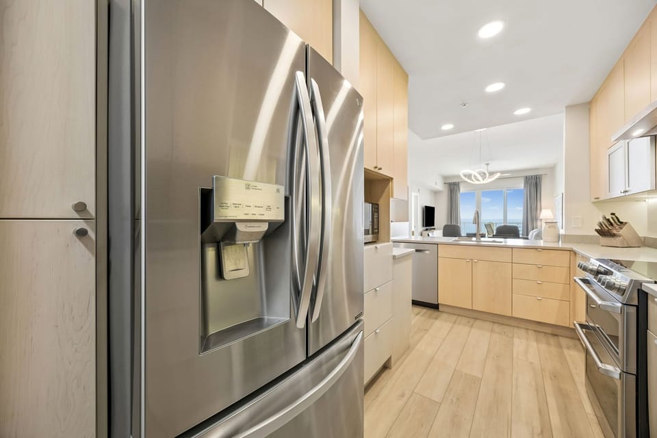 Spacious Modern Kitchen with Stainless Steel Appliances, Induction Stove, Wine Cooler, and Large Walk In Pantry