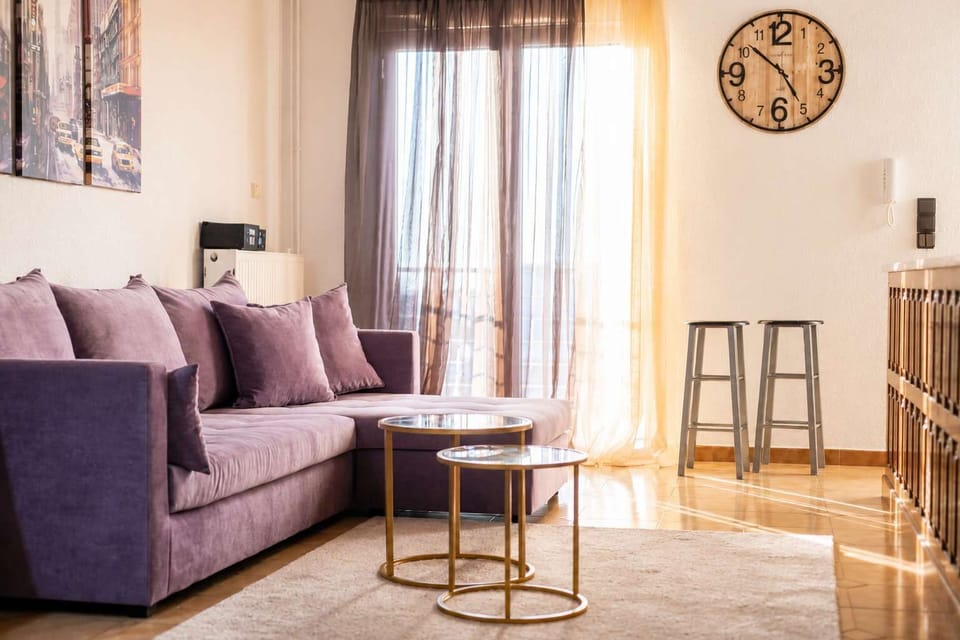 The living room offers comfortable seating, plenty of natural light, and a relaxing atmosphere. Whether reading, chatting, or enjoying a quiet evening, it’s designed to feel like home