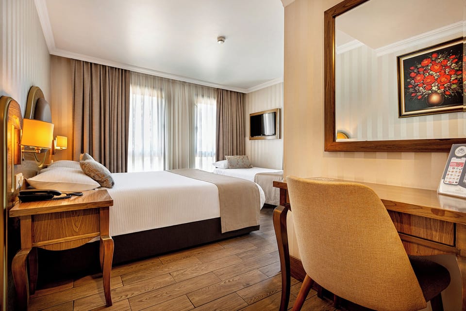 Family Quadruple Room, City View | Premium bedding, minibar, in-room safe, desk