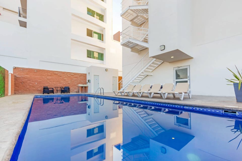 Outdoor pool, open 9:00 AM to 9:00 PM, pool umbrellas, sun loungers