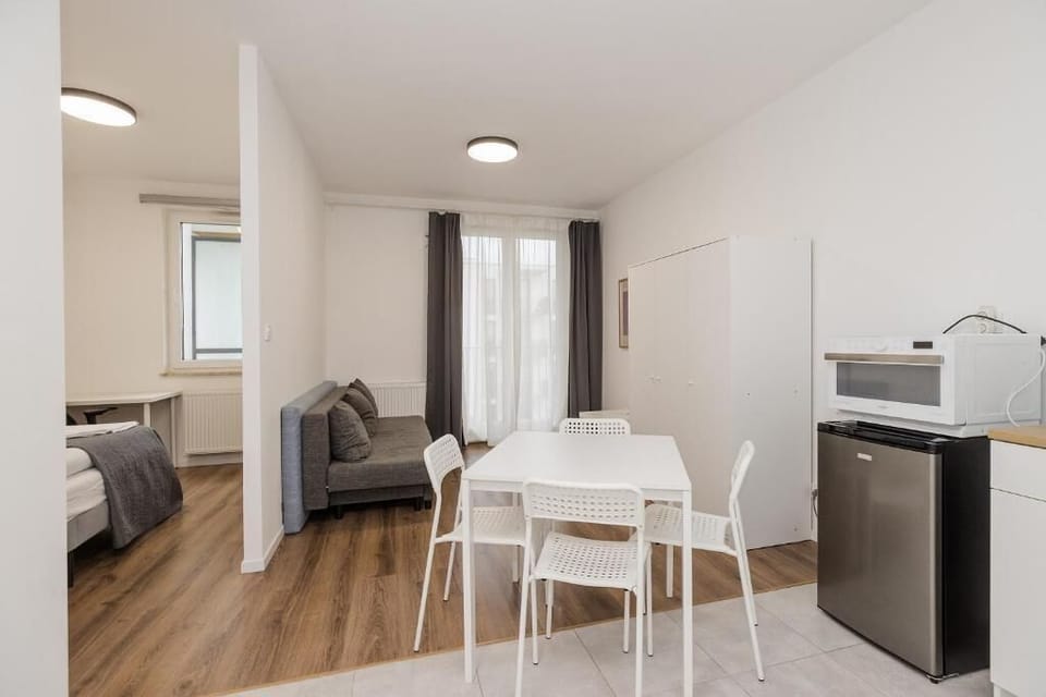 Classic Apartment, Balcony, City View | In-room dining