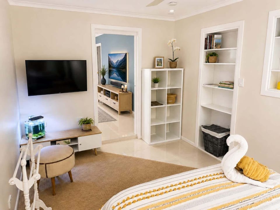 Queen bedroom with its own sitting area and TV.