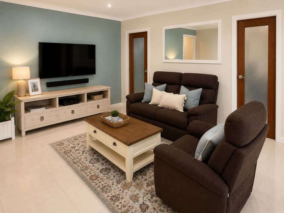 Spacious lounge with Smart TV and feet-up recliners.