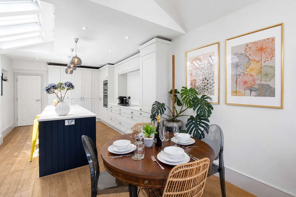 Dining Nook: Gather around the rustic table for delightful meals in this sunlit space!