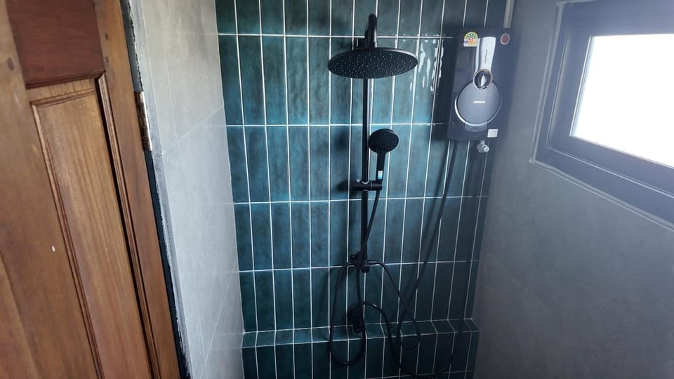 Basic Shared Dormitory, Mixed Dorm, Balcony, City View | Bathroom | Shower, rainfall showerhead, hair dryer, slippers