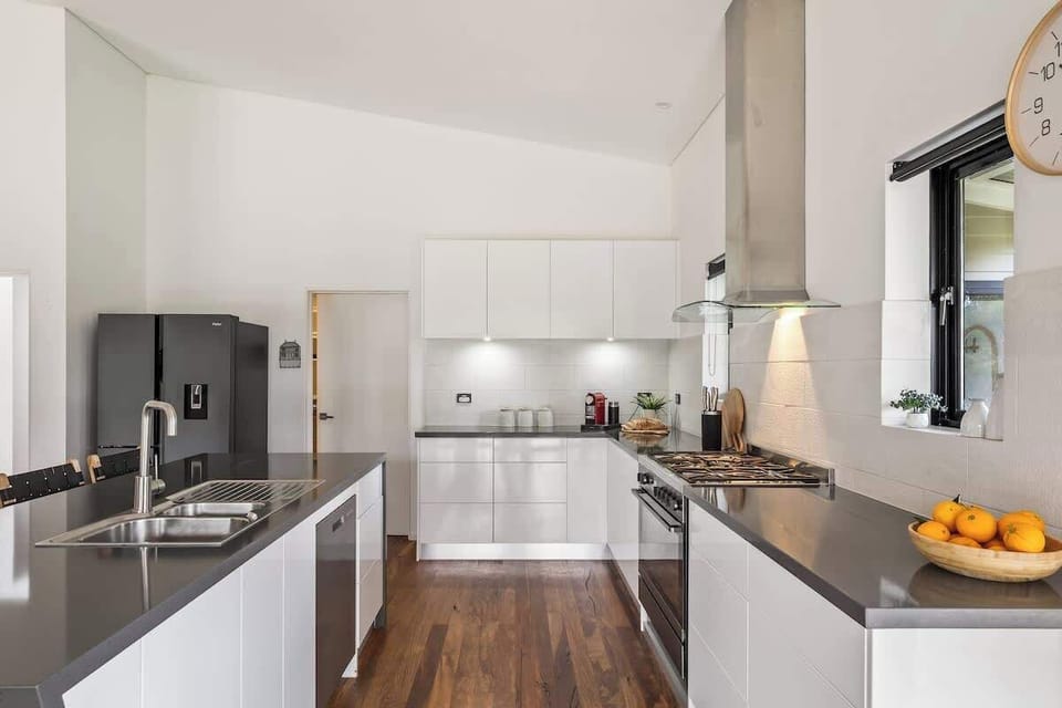 The kitchen combines practical functionality with contemporary styling, offering quality appliances and ample space to prepare everything from morning coffee to family feasts.