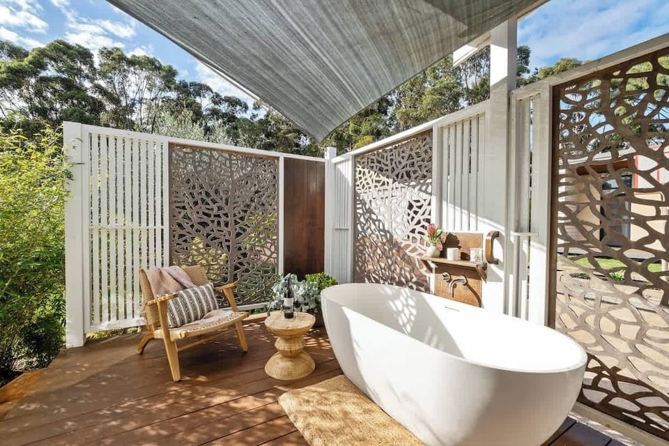 The outdoor bathtub offers a secluded place to slow down, surrounded by greenery and the gentle sounds of the countryside.