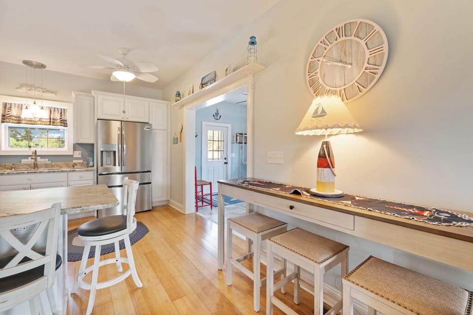 Living Area opens to Dining Area and Kitchen.