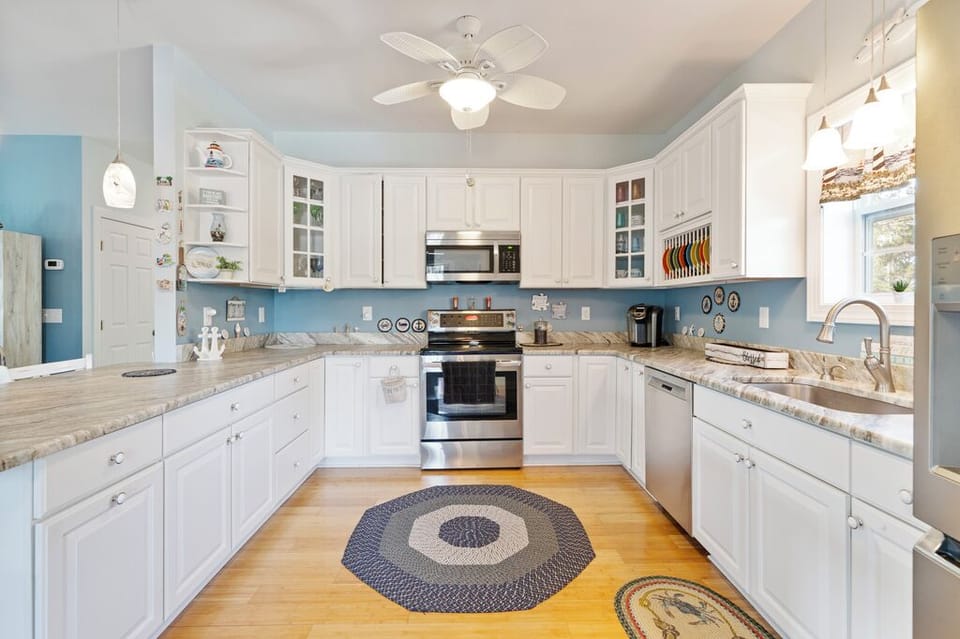 Beachy White Cabinetry and Stainless Appliances in the Chef's Kitchen.
