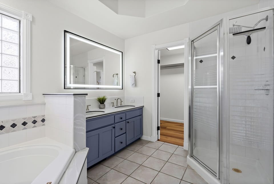 Bathroom 1 | Ensuite Bath with Walk-in Shower and Soaking Tub (main level)