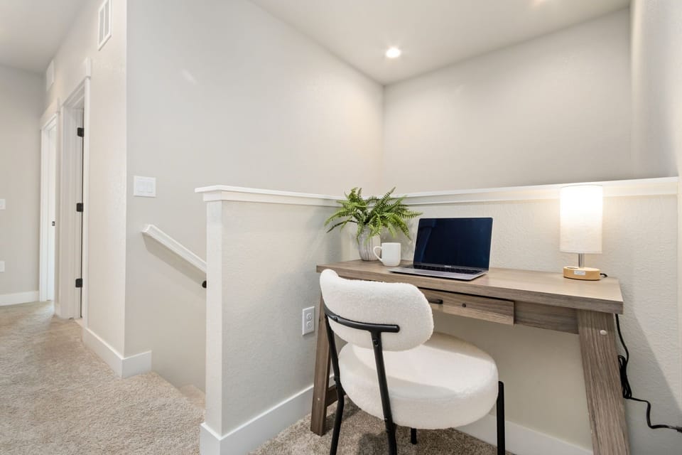 Settle in at your private workspace, where clean lines and natural light create the perfect setting for planning your days or catching up on work.