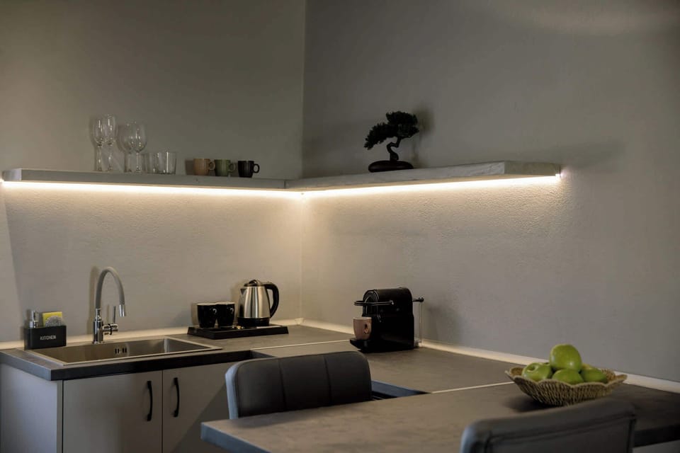 Modern kitchenette with clean finishes and thoughtful amenities.