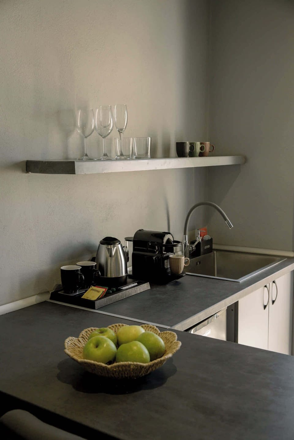 Compact kitchenette with coffee essentials and thoughtful amenities for a comfortable stay.