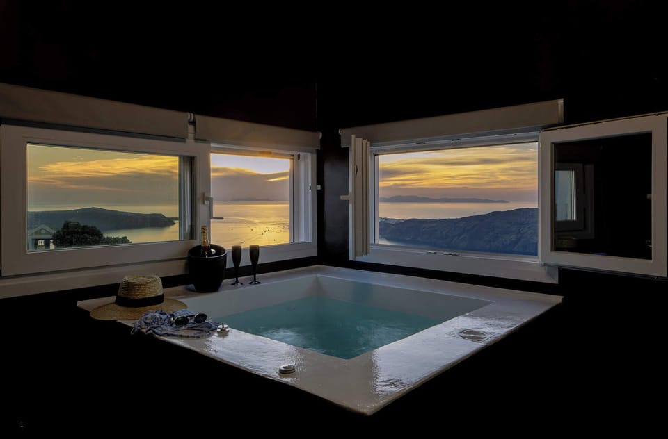 Private indoor jacuzzi with stunning sunset views over the Aegean.