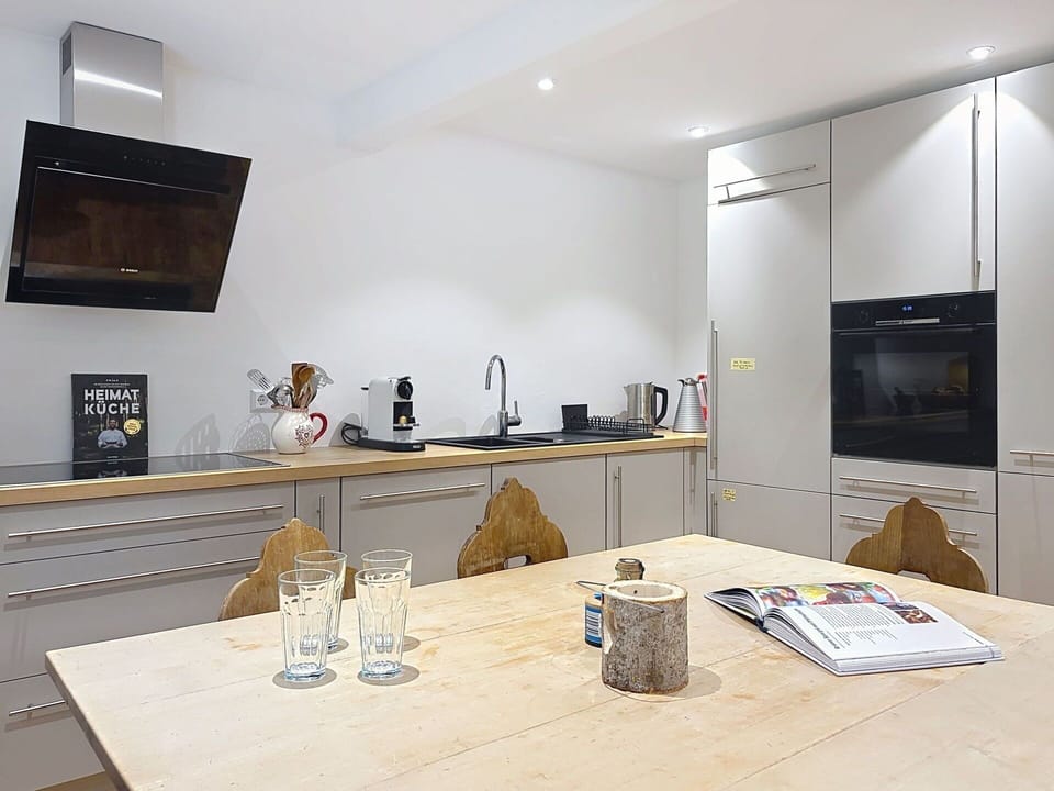 Furniture, Interior Design, Kitchen Appliance, Kitchen, Flooring, Countertop, Wood, Cabinetry, Ceiling, Floor