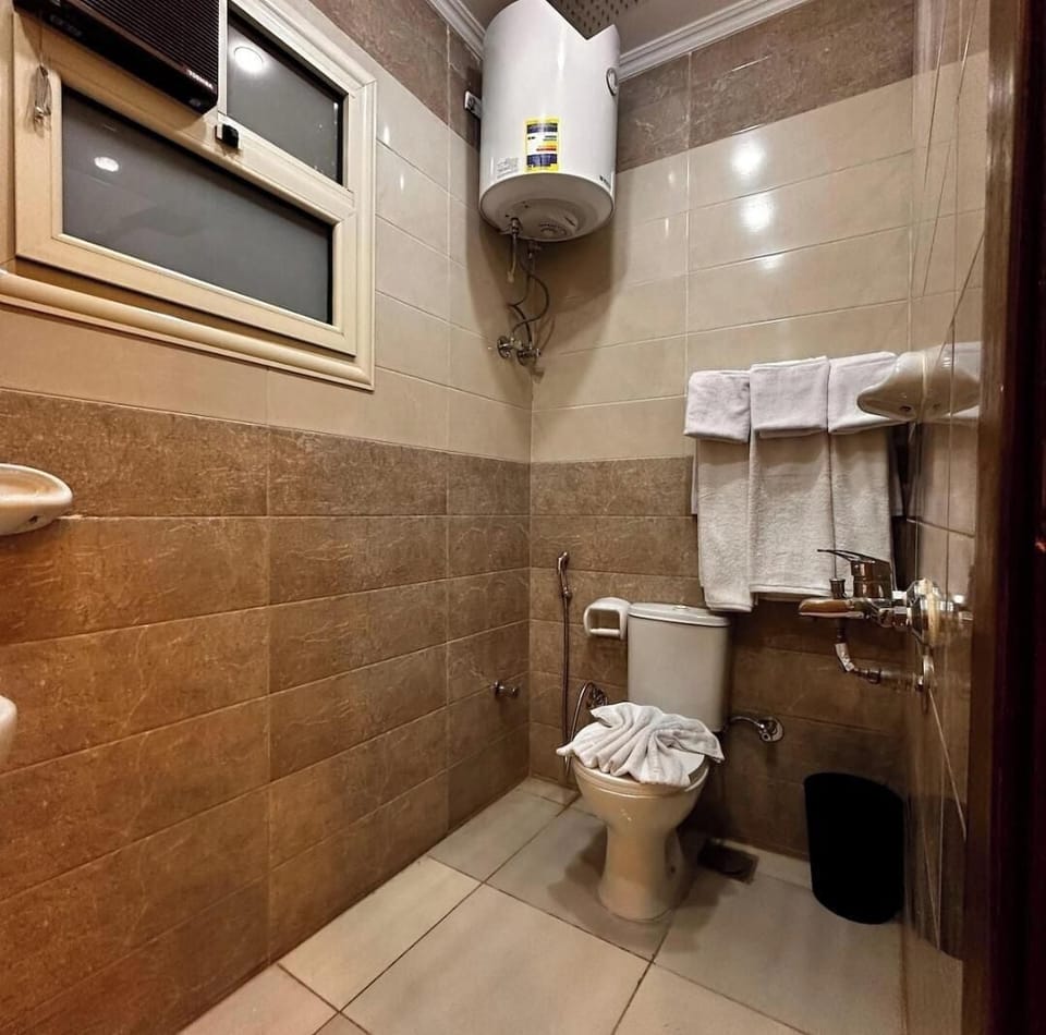 Combined shower/tub, hair dryer, towels, soap