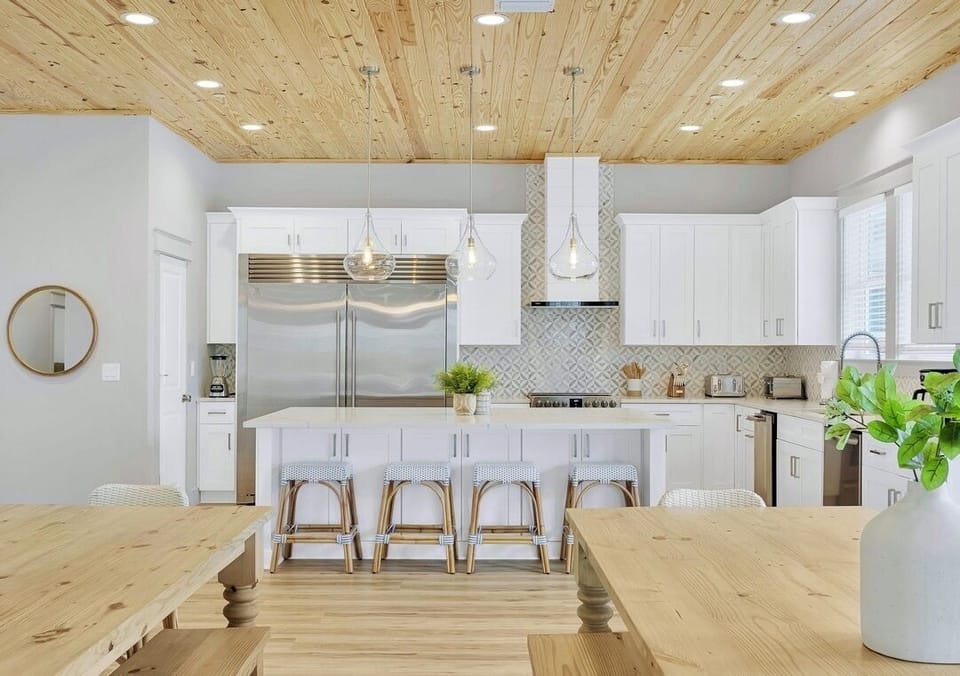 1st Floor - Fully stocked gourmet chef’s kitchen featuring a commercial-size refrigerator, gas range, oversized island, and everything needed to prepare meals for large groups. The heart of the home for cooking, gathering, and entertaining.
