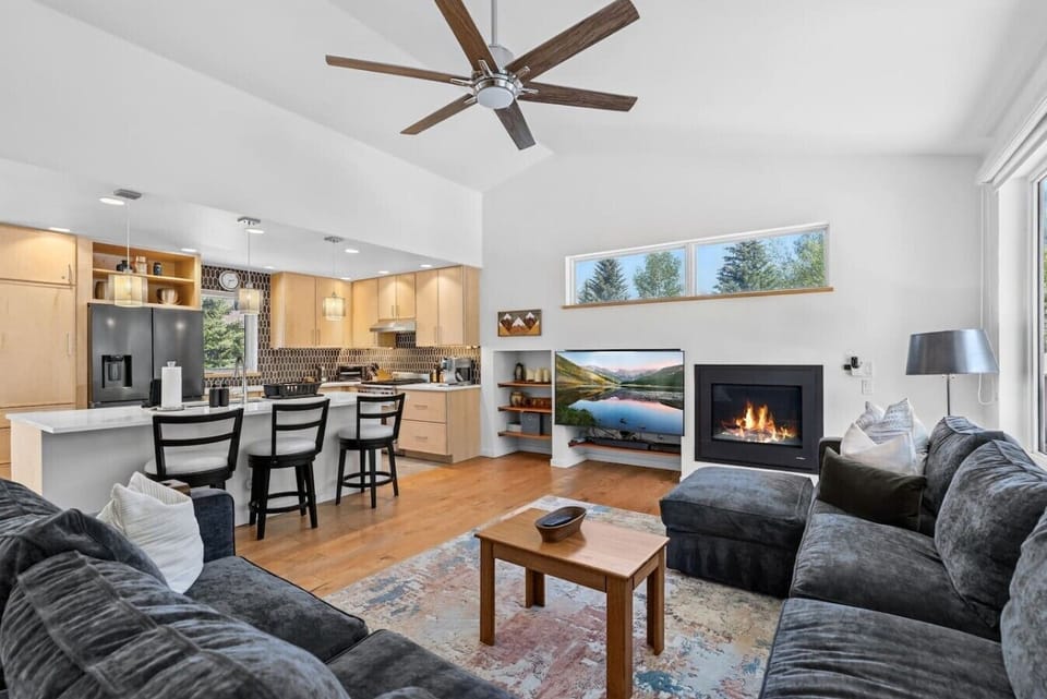 Spacious living room with fireplace and smart tv