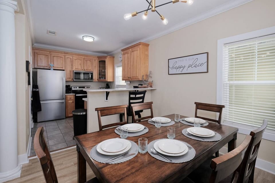 Brightly lit dining room and kitchen