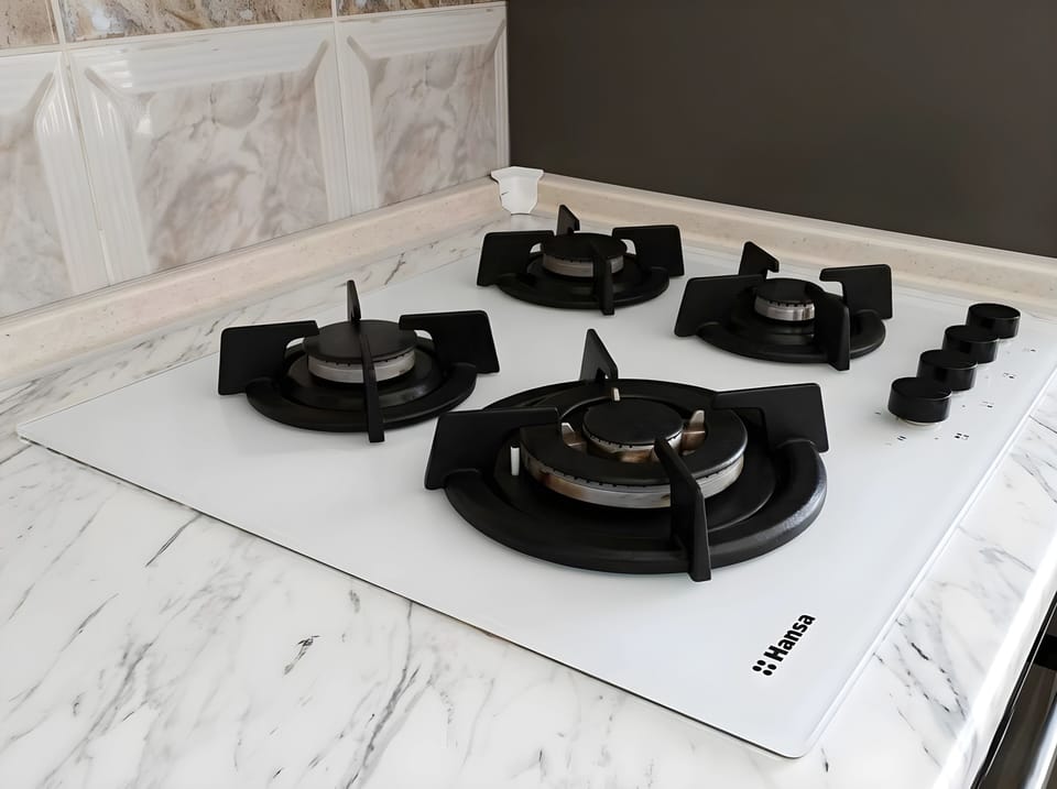 Hansa tempered glass countertop 4 gas burner hob with  hood. 