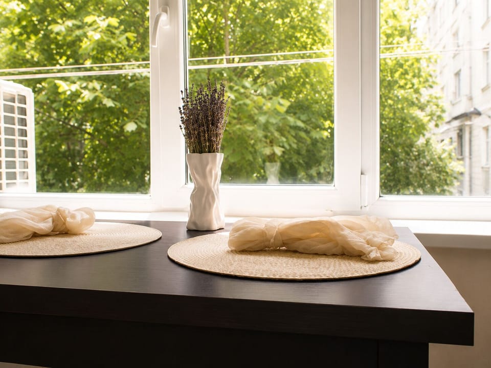 Dining table for two with a garden view.