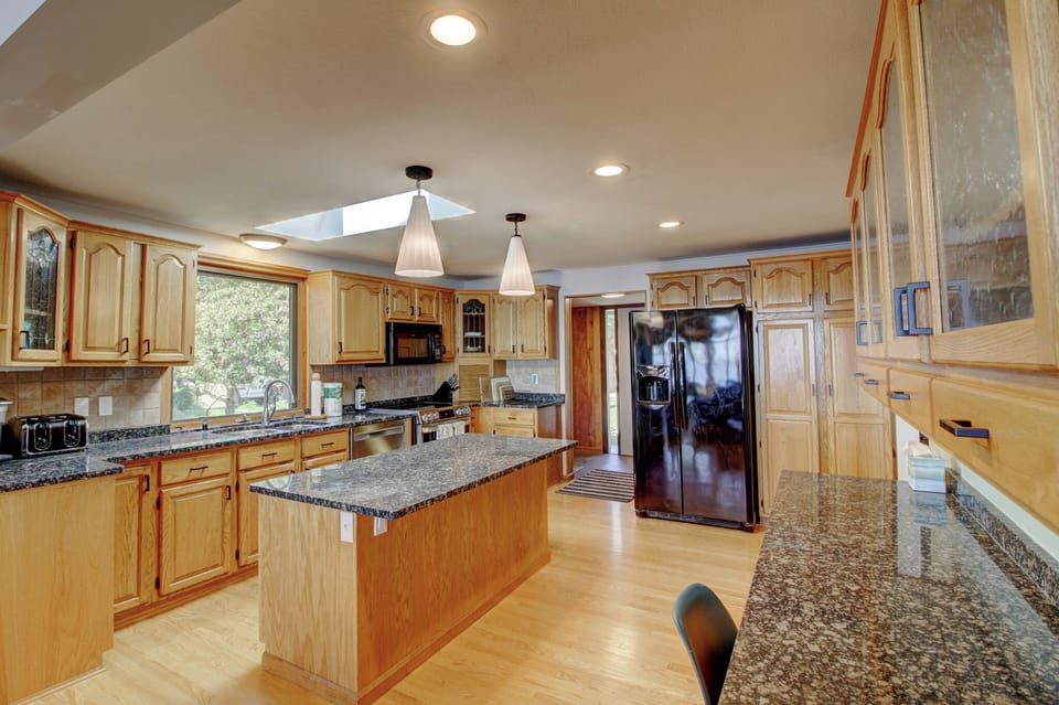 Granite counters, an oversized island, and all the cookware you need for a lake-house feast.