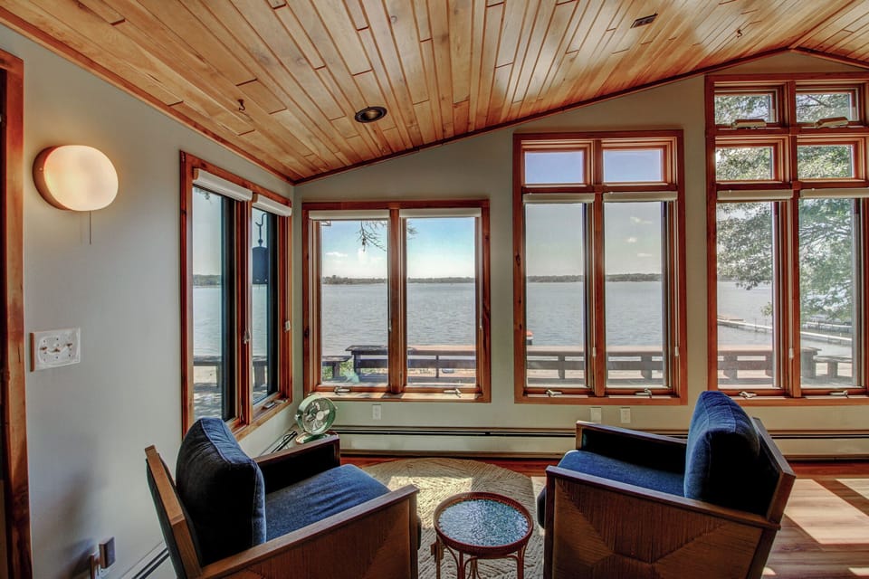 A quiet reading nook wrapped in windows, with front-row seats to the water.