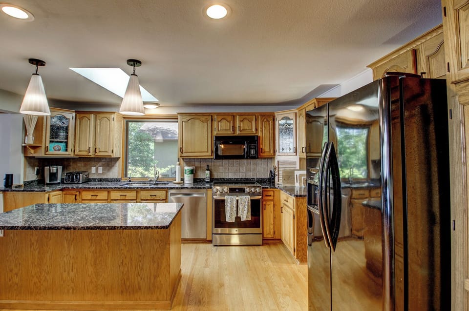 Stainless appliances and a spacious layout make cooking for a crowd easy.