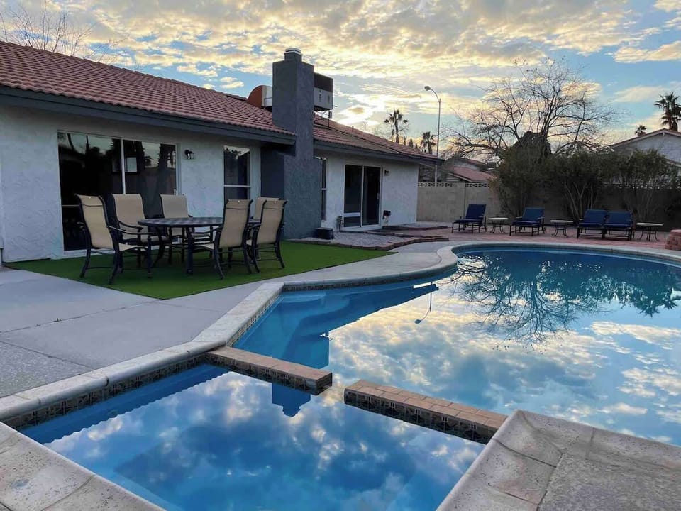 Poolside area includes stylish outdoor furniture and sun loungers. Spa use is complimentary, but pool heating requires an extra charge