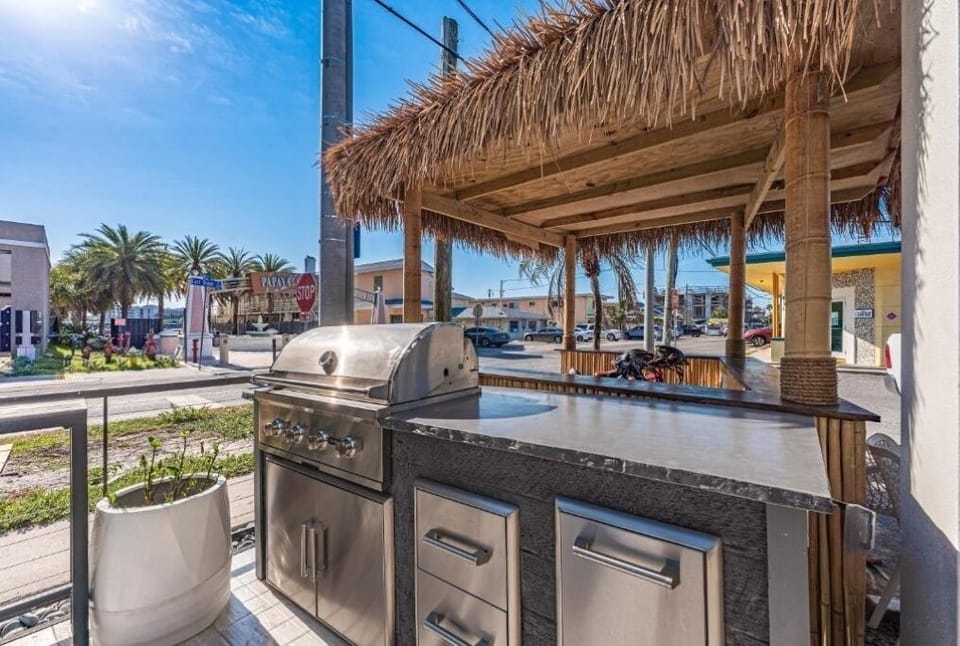 Prep drinks and snacks on spacious counters outdoors.