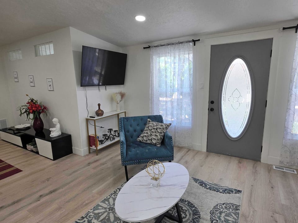 Spacious living area with cozy seating, entertainment setup, and easy flow to the rest of the home. Great for unwinding after a long day.