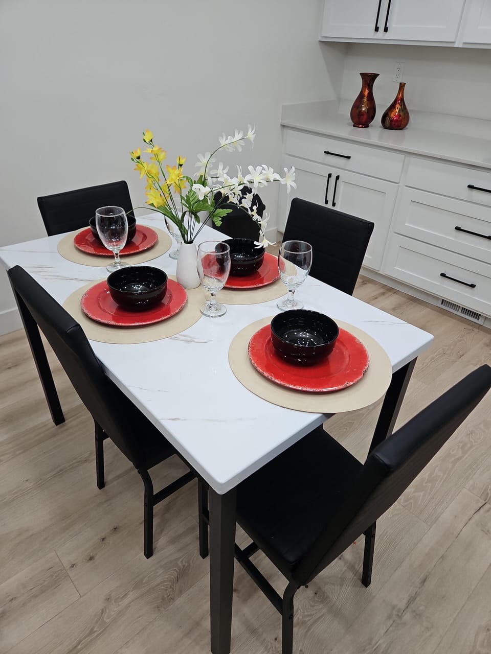 Spacious dining table ready for family dinners and gatherings.