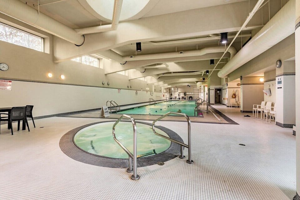 Indoor swimming pool with lounge space, perfect for relaxing during your downtown Vancouver stay.