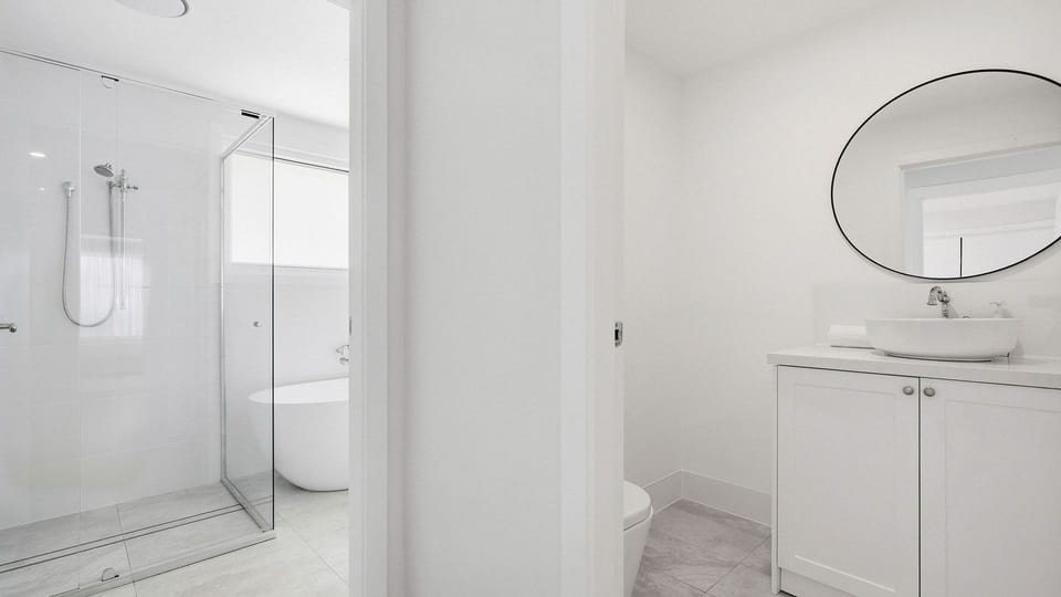 Unwind in crisp, spa-like luxury—your private minimalist oasis awaits.