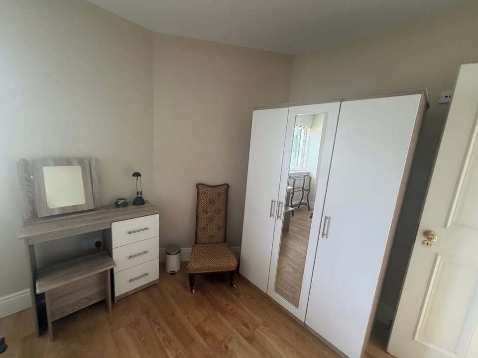 The spacious storage and dressing areas of the ground floor bedroom.