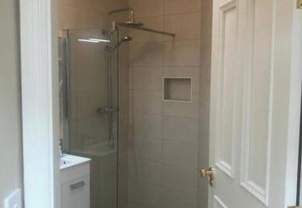 The ground floor bathroom has an accessible aspect and wetroom dual aspect shower.