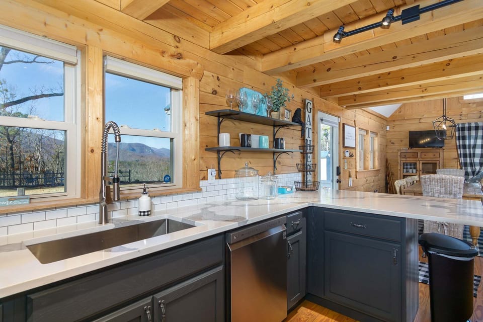 Sleek kitchen complete with dishwasher & Keurig style coffeemaker.