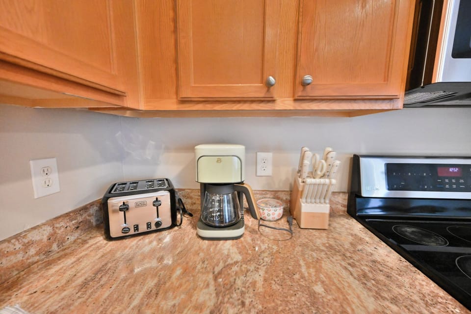 Fully equipped counter space with essential small appliances.