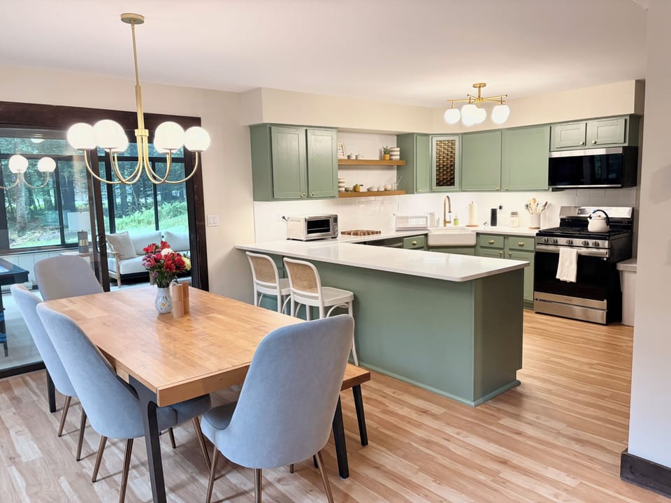 Open kitchen and dining - the heart of the house, fully stocked for groups
