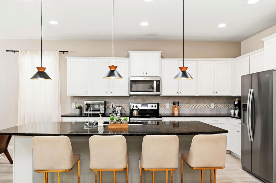 Elegant Kitchen: Modern design with sleek appliances and a spacious island for delightful gatherings!