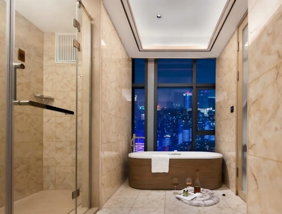 Panoramic Suite, City View | Bathroom | Hair dryer, towels, soap, shampoo