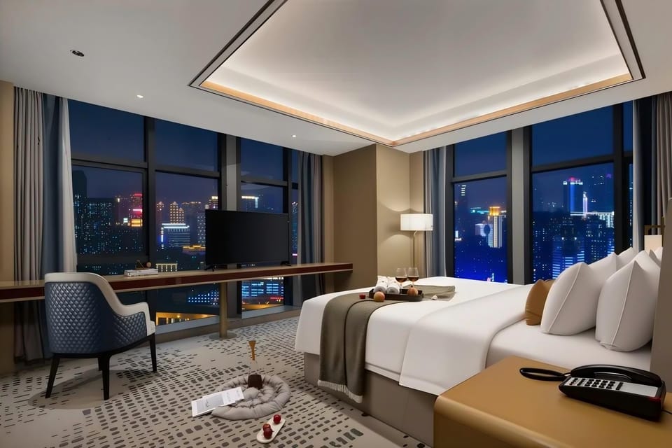 Panoramic Suite, City View | Desk, laptop workspace, WiFi (free), bed sheets