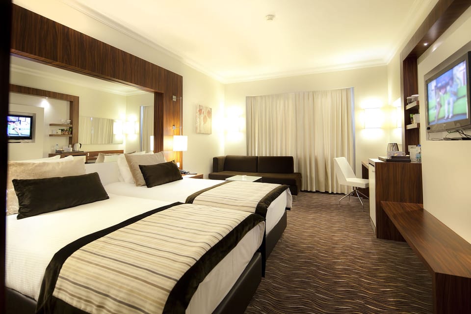 Family Room | Minibar, in-room safe, individually decorated, individually furnished