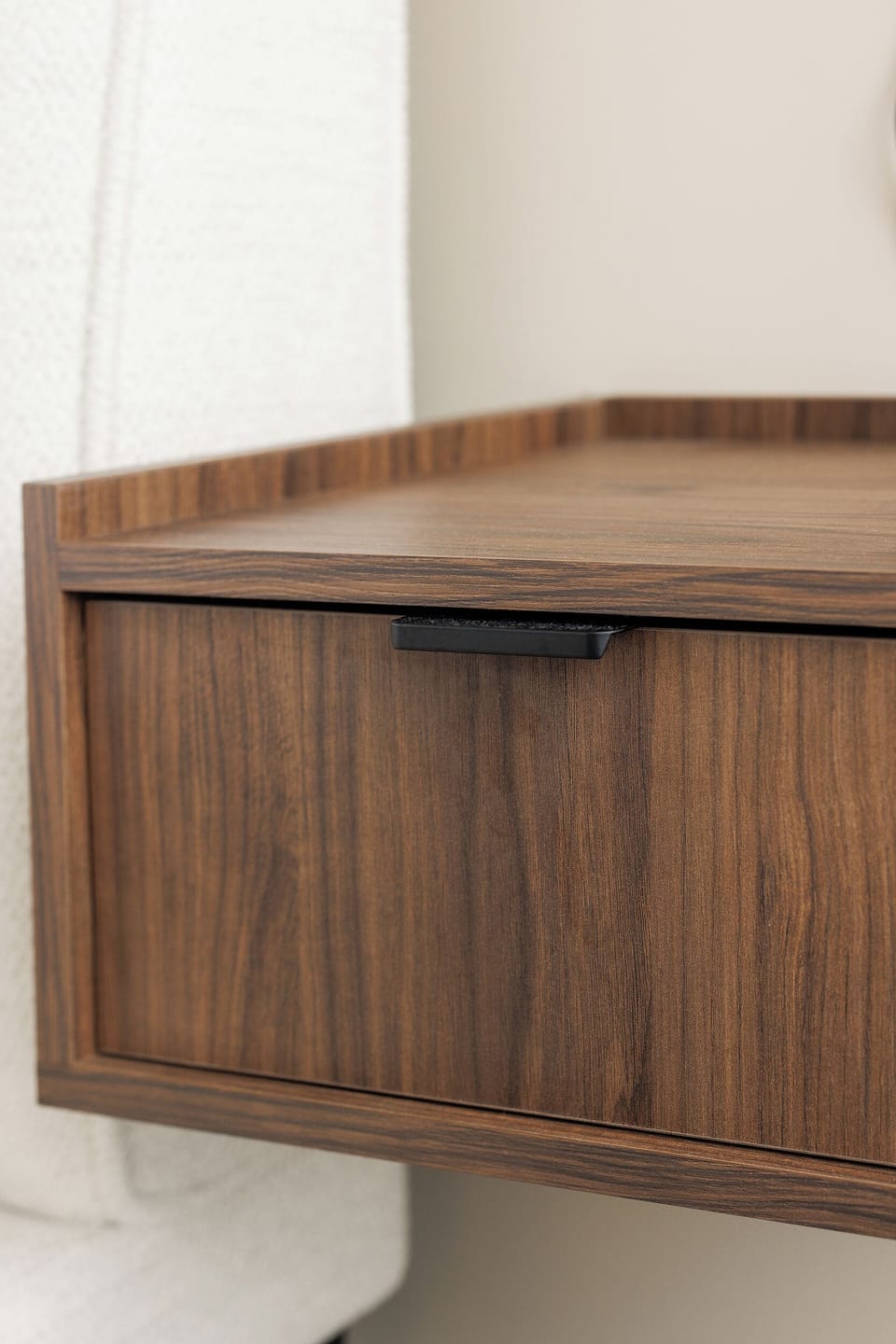 Modern wall-mounted walnut cabinet with sleek, space-saving storage