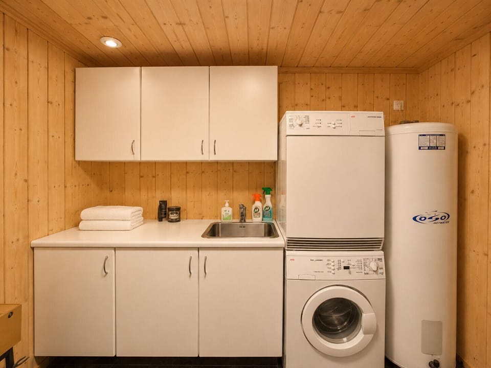 Laundry room with washing machine and dryer for longer stays